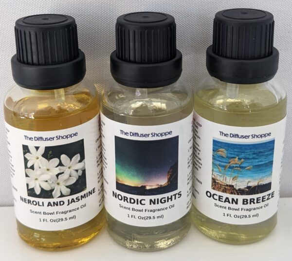 A group of three bottles with different scents.