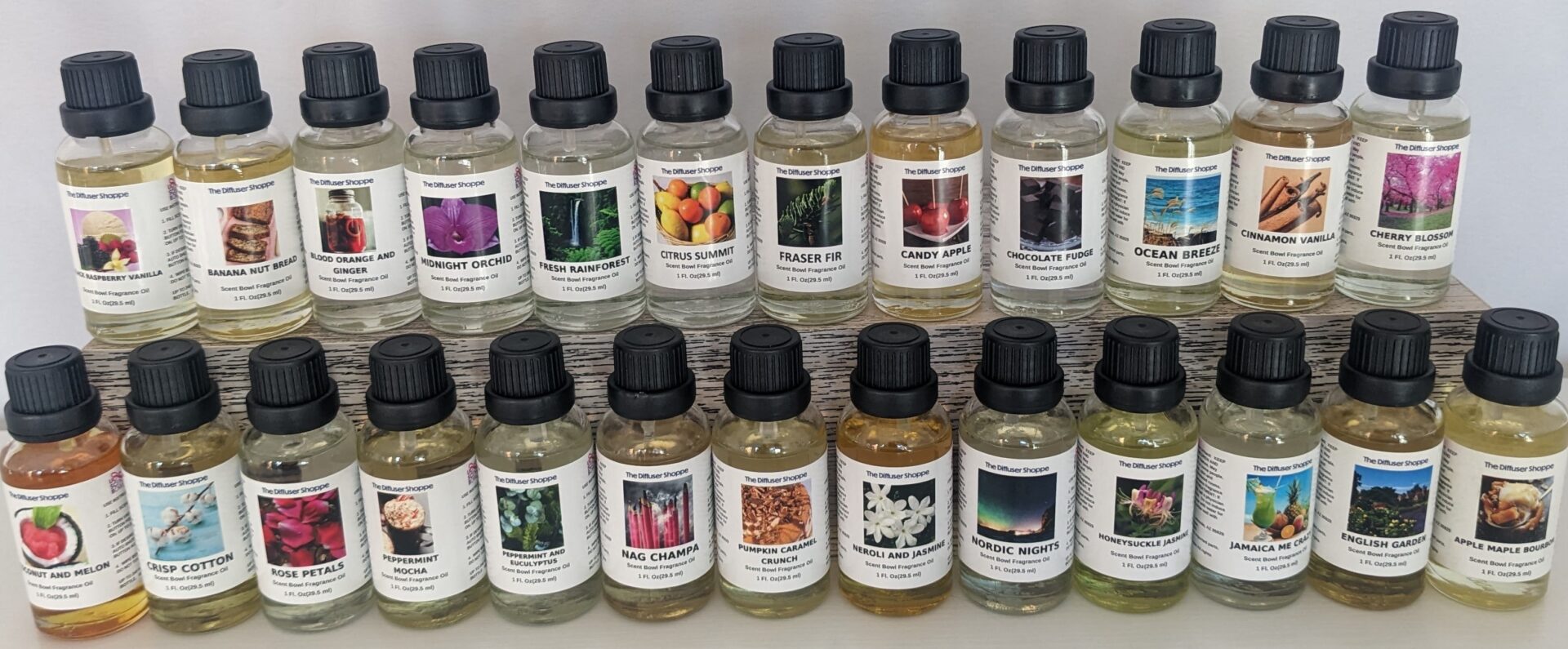 A shelf of different oils and their names.