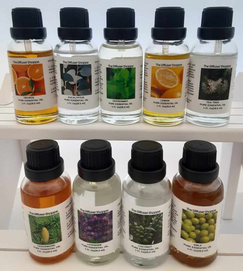 A shelf with many different bottles of oils.