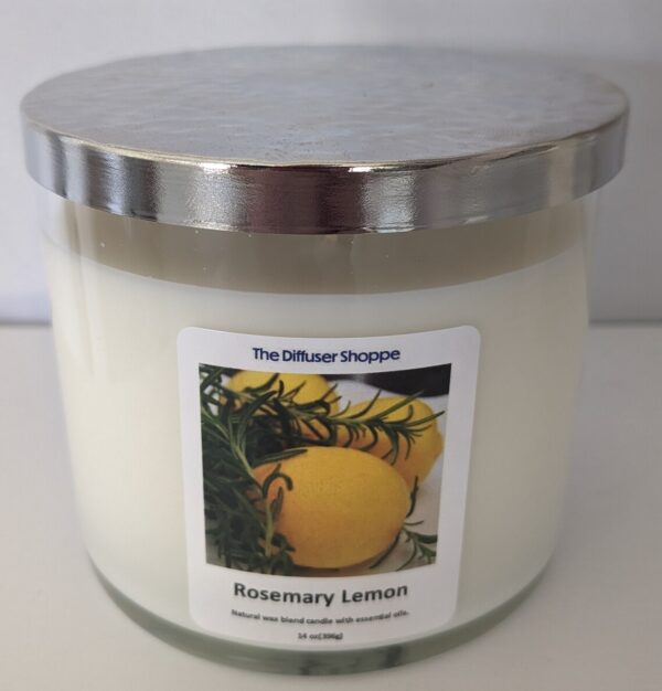 A candle that has been lit with the label of rosemary lemon.